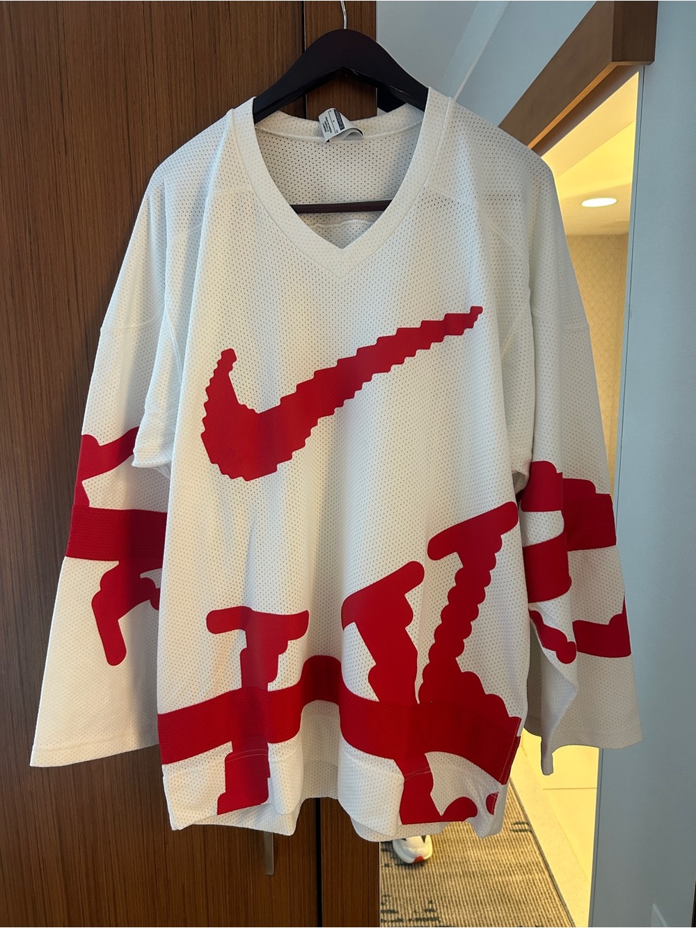 Oversized Nike White Mesh Jersey with Red Graphic Swoosh